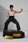 A boxed CHINA. X - H 1/6 Bruce Lee's 78th Anniversary Way Of The Dragon Figure.
