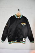An as new Mitchell & Ness 2013 - 2023 satin jacket with Jacksonville Jaguars logo to back of jacket