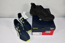 A pair of boxed Reebok Strively Rep trainers in CBLACK/PUGRY6/CBLACK (Size UK 10.5) and a pair of Re