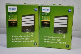 Two boxed as new Phillips LED Outdoor Wall Lights - Warm White Light - Raccoon / Anthracite / Sensor