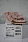 A pair of Kid's Arizona Shearling fur lined light Rose Birkenstocks (Size UK 13 (31) )