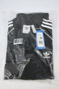 An as new Adidas black three striped track suit top (Size XL)