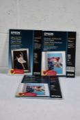 Nine Epson Premium Semigloss Photo Paper (20 sheets) and one Epson Ultra Glossy Photo Paper (15 shee