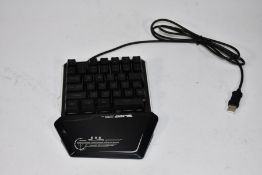 Ten black Lexon Tech one handed gaming keyboards with rainbow back lights.