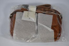 An as new Free People Wade Leather Sling.