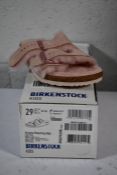 A pair of Kid's Arizona Shearling fur lined light Rose Birkenstocks (Size UK 11 (29) )