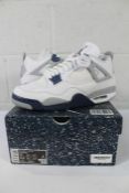 A pair of boxed as new Nike Air Jordan 4 Retro - white/midnight navy (UK 9).