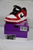 A pair of boxed as new Nike SB Dunk Low J-Pack Chicago (UK 6, Red/White-Black)