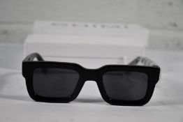 A pair of Chimi 05 rectangle-frame sunglasses (Unisex, some markings to case and bag).