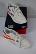 A pair of as new Reebok Classic Leather Trainers in Chalk (Size UK 7).