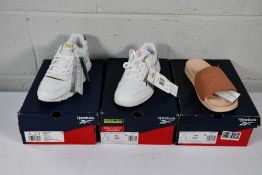 A pair of women's boxed Reebok Court Advance Vega trainers in FTWWHT/PNKGLW/FORGRN (Size UK 4), a pa