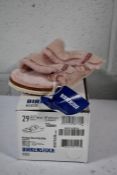 A pair of Kid's Arizona Shearling fur lined light Rose Birkenstocks (Size UK 11 (29) )
