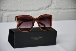 A pair of women's Police Stagedive sunglasses shiny transparent light brown SPLD30 with case.