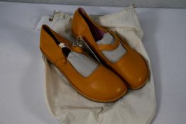A pair of Gudrun Sjoden Swedish leather strap shoes in Ochre (Size 41).