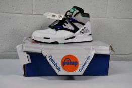 A pair of as new Reebok Pump Ommi Zone II basket ball trainers (Size UK11) (Box damaged).
