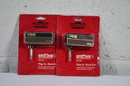 Two Vox amPlug2 AC30 headphone guitar amplifiers.