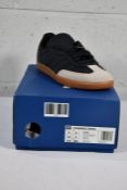 A pair of boxed as new Adidas Samba Pharrell Humanrace black trainers (UK 9).