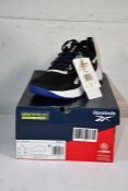 A pair of boxed Reebok Memerytech Comfortbed CBLACK/FTWWHT/BOLPRP NFX trainers (UK 4.5).