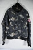 A pre-owned Canada Goose Faber Bomber Jacket with Nocturne Print, Size M.