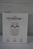 A boxed as new Eclair LED Therapy Mask.