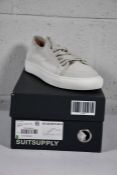 A pair of boxed as new SuitSupply Suede - Uni sneaker in off white (Size UK 8 EU 42).
