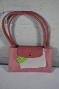 An as new Longchamp Le Pliage Green Petal Pink Shoulder Bag.