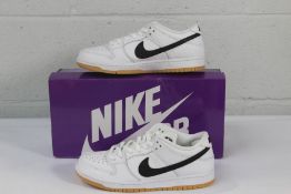 A pair of boxed as new Nike SB Dunk Low Pro White/Black (Size UK 6).