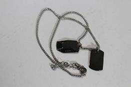 A Diesel double dog-tag necklace (possibly pre-owned, no inscriptions).