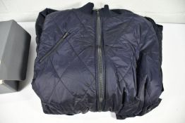 An as new Wild Swans 22.3 Project AJ Nuka Quilted Parka Coat in Midnight, Size M.