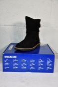 A pair of as new Birkenstock Uppsala Shearling Boots in Black, Size UK 5.5.