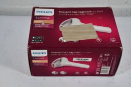 A boxed Phillips Lumea Prestige hair remover (Outer box damaged).