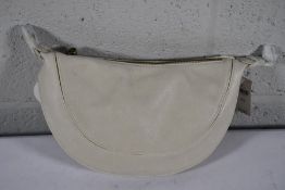 An as new Urban Originals Super Mini Luna Bag in Ivory.