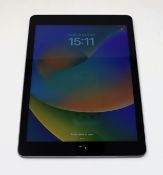 A pre-owned Apple iPad 9.7