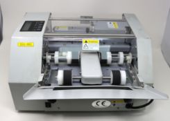 A pre-owned SSA-001 Business Card Cutting Machine (Powers on, not tested further. Sold as seen).