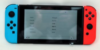 A pre-owned Nintendo Switch Handheld Console (HAC-001) 32GB with Neon Blue/Red Joy-Con Controllers,