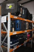 A quantity of preowned suitcases and related items.