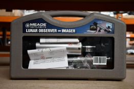 A boxed Meade lunar observer and imager