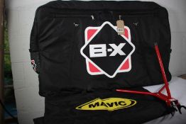 Two bicycle transportation bags (Wheeled) c/w carrying straps, two bicycle 'Pit Stands' and a pair o