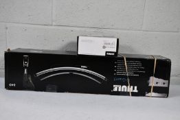 A boxed Thule K - Guard lockable and tiltable Kayak car carrier and a Thule fitting Kit 18 6030.
