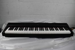 A boxed as new Yamaha P-121B Digital Piano.