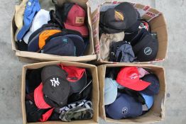 Approximately one hundred pre-owned baseball caps and related.