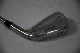 A Titleist 4 Iron 620 Forged golf club.