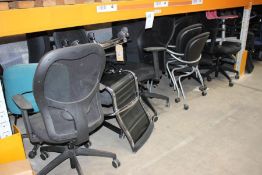 A large quantity of office clearance computer chairs in assorted styles and colours.