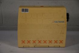 A pre-owned Vintage Frister Rossmann Club 4 sewing machine with original case.