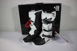 A pair of as new Alpinestars youth motorcycle boots in black and white (Euro 34).