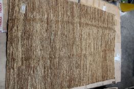 A Jute Rug in light brown (140 x 200cm, possibly Benuta).
