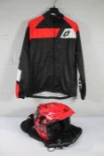 An Adults Comas Trials Bike Helmet in red, size medium and an Adults Jitsie Trials Bike Jacket, size