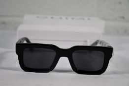 A pair of Chimi 05 rectangle-frame sunglasses (Unisex, some markings to case and bag).