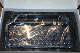An as new Qwerkywriter Typewriter Inspired Mechanical Keyboard, Black.