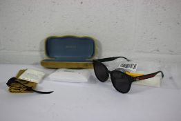 A pair of as new Gucci GG0855SK 001 Black Oval Sunglasses in Black/Green/Grey and an as new Gucci Se